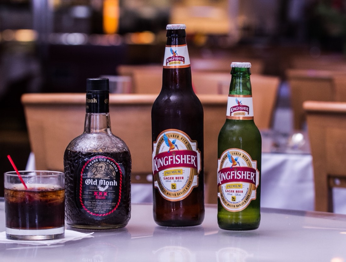 Cold beer and a cocktail on a table in the restaurant