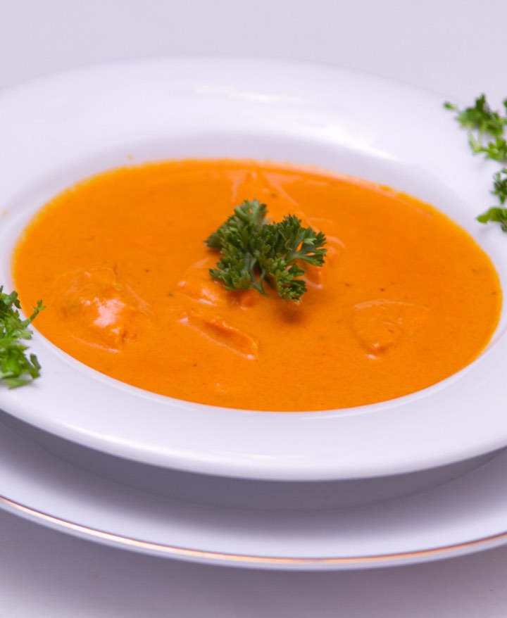 Roasted pumpkin soup in a white bowl