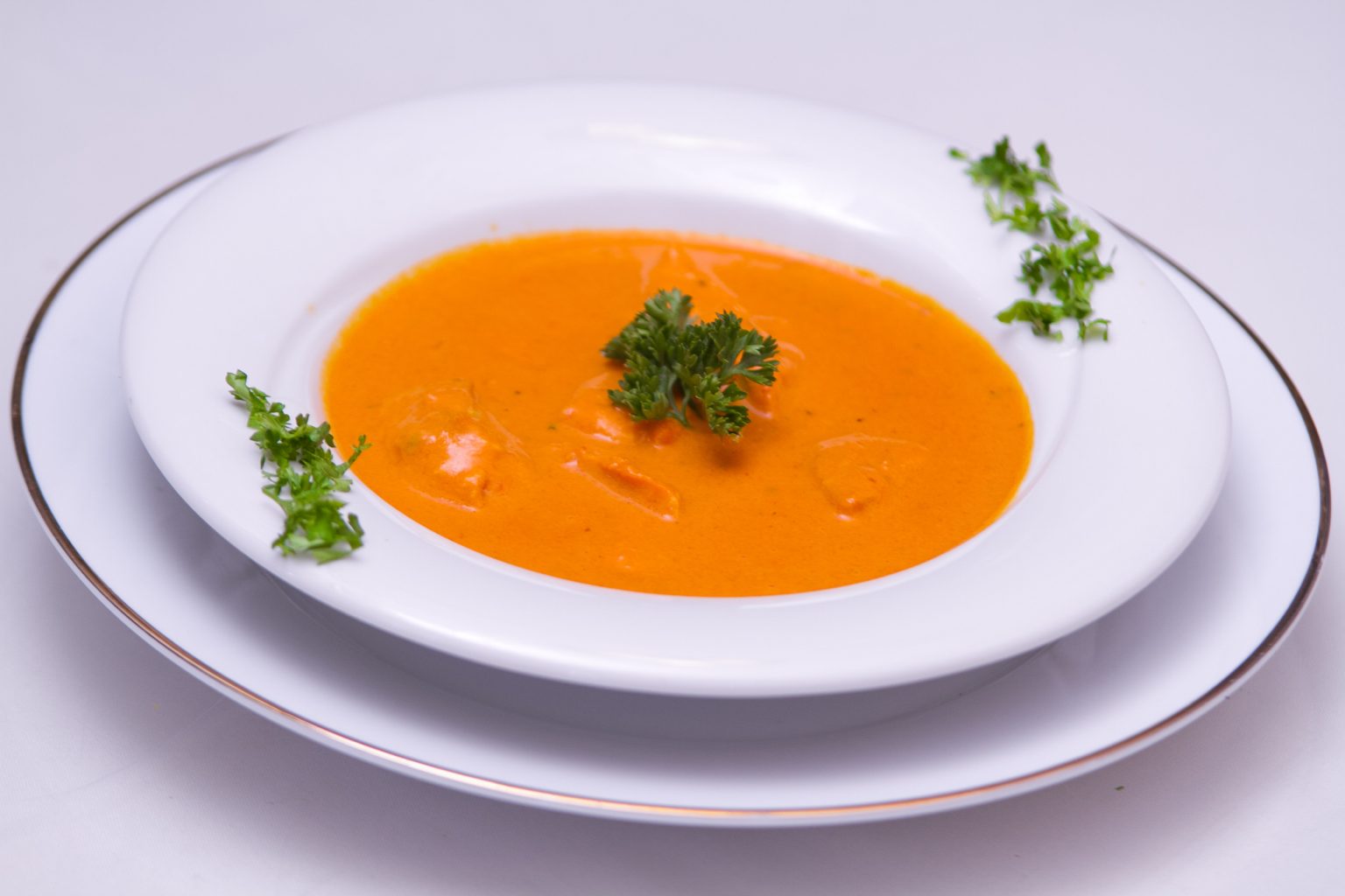 Roasted pumpkin soup in a white bowl